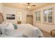 Bright bedroom with natural light, neutral decor, and an ensuite bathroom at 6874 Valhalla Way, Windermere, FL 34786