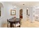 Cozy dining nook with a modern chandelier and a view of other living spaces at 6874 Valhalla Way, Windermere, FL 34786