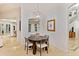 Bright dining nook featuring a modern chandelier, and a view of other living spaces at 6874 Valhalla Way, Windermere, FL 34786