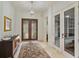 Inviting entryway with decorative rug, chandelier, and custom wood doors providing an elegant and welcoming ambiance at 6874 Valhalla Way, Windermere, FL 34786