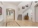 Elegant entryway with tile flooring and a grand staircase at 6874 Valhalla Way, Windermere, FL 34786