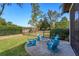 Firepit surrounded by blue chairs on a brick patio at 6874 Valhalla Way, Windermere, FL 34786