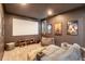 Home theater room with projector screen, comfortable seating, and movie posters at 6874 Valhalla Way, Windermere, FL 34786