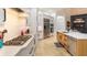 Modern kitchen featuring stainless steel appliances, an island with a sink, and elegant white cabinetry at 6874 Valhalla Way, Windermere, FL 34786