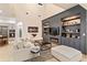 Elegant living room with built-in shelving and a modern fireplace at 6874 Valhalla Way, Windermere, FL 34786