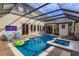 Inviting pool area with covered lanai, spa, and outdoor kitchen at 6874 Valhalla Way, Windermere, FL 34786