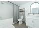 Updated bathroom with white subway tile and a soaking tub at 7007 Seminole Dr, Belle Isle, FL 32812