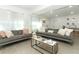 Open living area with gray sectional and modern decor at 7007 Seminole Dr, Belle Isle, FL 32812