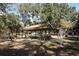 Covered picnic pavilion with tables and benches in a shady park setting at 7007 Seminole Dr, Belle Isle, FL 32812