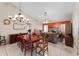 Dining room with wood table and chairs, view to living room at 7025 Hiawassee Oak Dr, Orlando, FL 32818