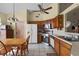 Galley kitchen with wood cabinets and tiled floors at 7025 Hiawassee Oak Dr, Orlando, FL 32818