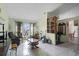 Living room featuring tiled floors, large window and exercise bike at 7025 Hiawassee Oak Dr, Orlando, FL 32818