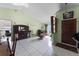 Bright living room with tiled floors and a wood cabinet at 7025 Hiawassee Oak Dr, Orlando, FL 32818