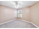 Spacious bedroom with ceiling fan and neutral carpeting at 731 Sugar Bay Way # 103, Lake Mary, FL 32746