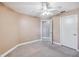 Well-lit bedroom featuring ceiling fan and carpet flooring at 731 Sugar Bay Way # 103, Lake Mary, FL 32746