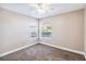 Bright bedroom with two windows and neutral carpeting at 731 Sugar Bay Way # 103, Lake Mary, FL 32746