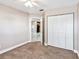 Spacious bedroom with ample closet space and carpet flooring at 731 Sugar Bay Way # 103, Lake Mary, FL 32746