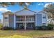 Front view of a two-story light blue condo building at 731 Sugar Bay Way # 103, Lake Mary, FL 32746