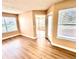 Inviting living room with wood-look floors, filled with natural light from the windows at 731 Sugar Bay Way # 103, Lake Mary, FL 32746