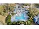 L-shaped community pool with lounge chairs at 731 Sugar Bay Way # 103, Lake Mary, FL 32746