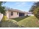 Landscaped backyard with spacious lawn at 7895 Saint Giles Pl, Orlando, FL 32835