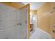 Bathroom featuring a large shower and updated vanity at 7895 Saint Giles Pl, Orlando, FL 32835