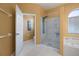 Bathroom features a walk-in shower, toilet, and garden tub at 7895 Saint Giles Pl, Orlando, FL 32835