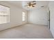 Large bedroom with double doors and window at 7895 Saint Giles Pl, Orlando, FL 32835