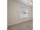 Well-lit bedroom featuring a window with blinds at 7895 Saint Giles Pl, Orlando, FL 32835