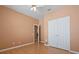 Light bedroom with wood flooring and door to hallway at 7895 Saint Giles Pl, Orlando, FL 32835