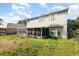 Spacious backyard view of the home's back exterior with a covered patio at 7909 Chartreux Ln, Maitland, FL 32751