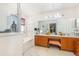 Bright and roomy bathroom area with a combined tub and shower behind glass doors at 7909 Chartreux Ln, Maitland, FL 32751