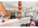 Cozy kitchen with breakfast bar, wooden cabinets, and black appliances at 7909 Chartreux Ln, Maitland, FL 32751