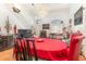 Bright living and dining area featuring high ceilings, hardwood floors and elegant chandelier at 7909 Chartreux Ln, Maitland, FL 32751