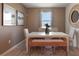 A well-lit dining room with beige walls and a wood bench at 867 Pebble Crest Ln, Eagle Lake, FL 33839