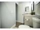 Updated bathroom with a toilet, sink, and access to another room at 884 Great Bend Rd, Altamonte Springs, FL 32714