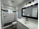 Modern bathroom with white subway tile, dark gray floor tile, and a walk-in shower at 884 Great Bend Rd, Altamonte Springs, FL 32714