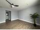 Bright bedroom with wood-look floors, ceiling fan, and en-suite bathroom access at 884 Great Bend Rd, Altamonte Springs, FL 32714