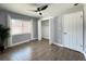 Spacious bedroom with wood-look floors, window, ceiling fan and closet at 884 Great Bend Rd, Altamonte Springs, FL 32714