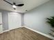 Spacious bedroom with wood-look floors, double closet and ceiling fan at 884 Great Bend Rd, Altamonte Springs, FL 32714