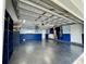 Garage with painted walls, storage shelving, and epoxy flooring at 884 Great Bend Rd, Altamonte Springs, FL 32714