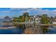 Luxury home on the lake with dock and lush landscaping at 9122 Bay Point Dr, Orlando, FL 32819