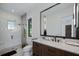 Modern bathroom with a walk-in shower and floating vanity at 9122 Bay Point Dr, Orlando, FL 32819