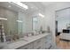 Bathroom boasts a double vanity, a large mirror, and a walk in shower at 9122 Bay Point Dr, Orlando, FL 32819