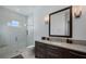 Bathroom with a walk-in shower and modern vanity at 9122 Bay Point Dr, Orlando, FL 32819