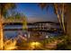 Private boat dock at night, waterfront property at 9122 Bay Point Dr, Orlando, FL 32819