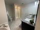 Elegant bathroom with double vanity, shower, and soaking tub at 1012 Anchorage Street, Leesburg, FL 34748