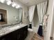 Clean bathroom with granite vanity and a bathtub at 1012 Anchorage Street, Leesburg, FL 34748