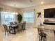 Bright dining area with a wood table and six chairs at 1012 Anchorage Street, Leesburg, FL 34748