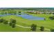 Golf course with lake and residential homes at 10329 Belfry Cir, Orlando, FL 32832